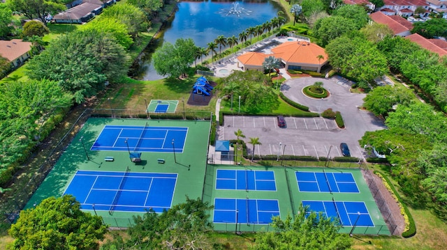 birds eye view of property with a water view