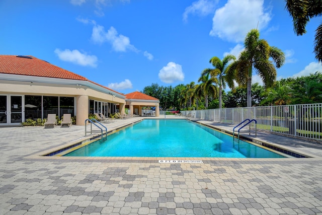 view of swimming pool featuring a patio area and a gazebo