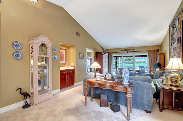 tiled living room with vaulted ceiling