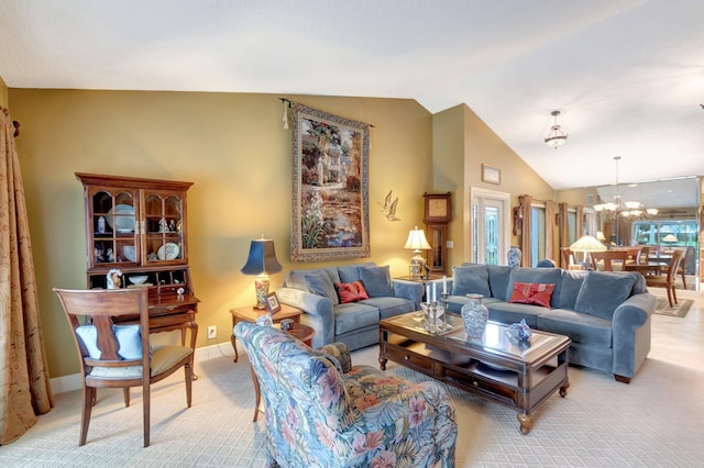 carpeted living room featuring an inviting chandelier and lofted ceiling