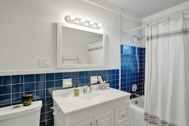 full bathroom featuring tile walls, vanity, shower / bath combo with shower curtain, and toilet