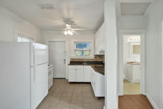 kitchen with sink, white cabinets, white appliances, ceiling fan, and backsplash