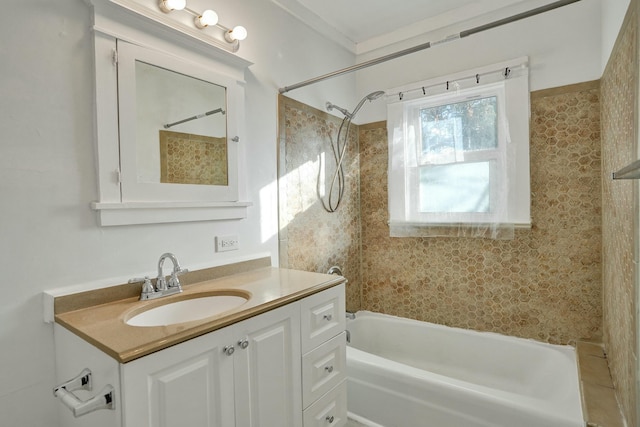 bathroom with vanity and tiled shower / bath