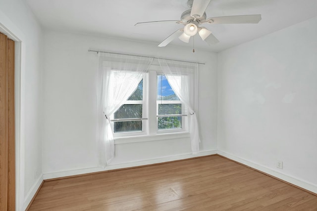 unfurnished room with light hardwood / wood-style floors and ceiling fan