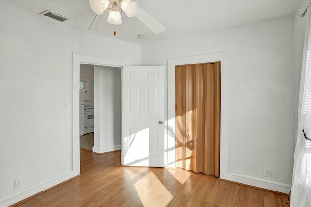 unfurnished bedroom featuring ceiling fan and light wood-type flooring