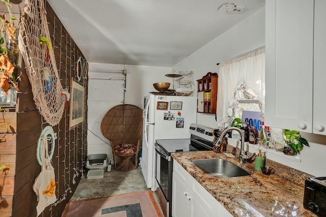 kitchen with white cabinets, stone countertops, stainless steel range with electric stovetop, and sink