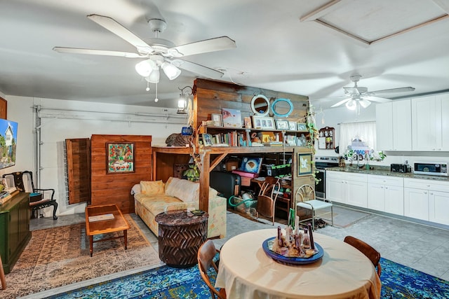 living room featuring sink and ceiling fan