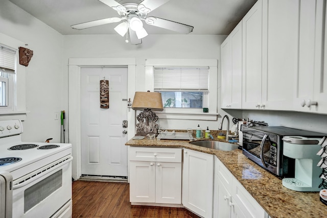 kitchen with sink, white electric range, white cabinets, and stone countertops