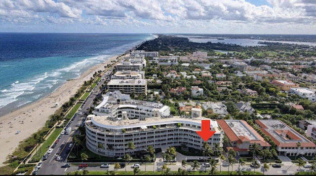 bird's eye view featuring a beach view and a water view