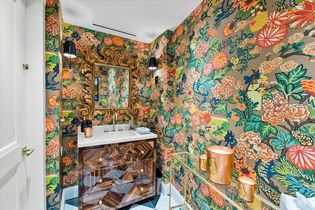 bathroom with tile patterned floors and vanity