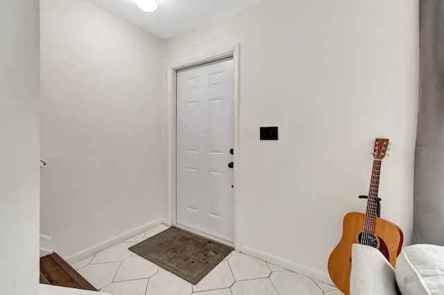 foyer featuring light tile patterned flooring