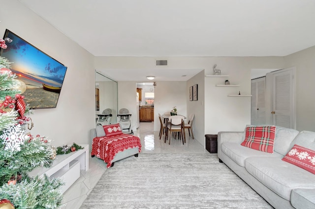 living room with light tile patterned floors