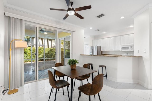 dining area featuring light tile patterned floors, recessed lighting, visible vents, baseboards, and ornamental molding