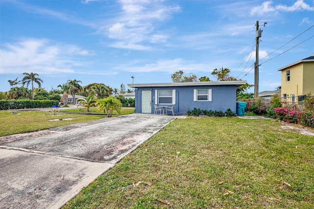 ranch-style house with a front lawn