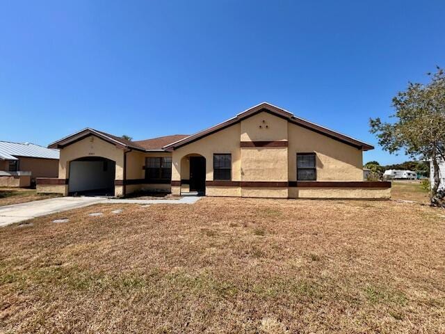 single story home featuring a garage