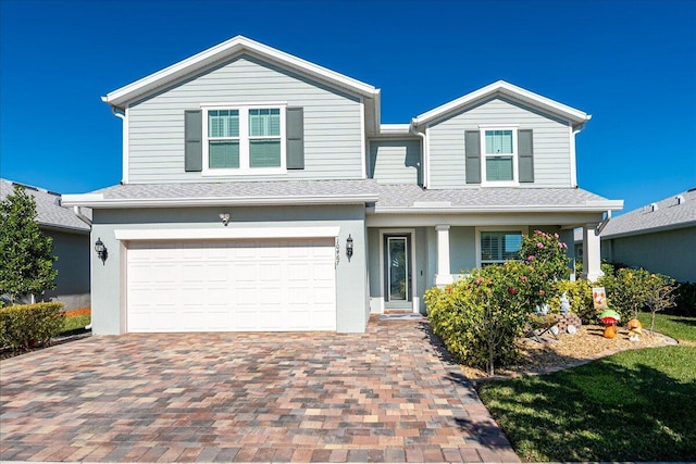 front of property with a garage