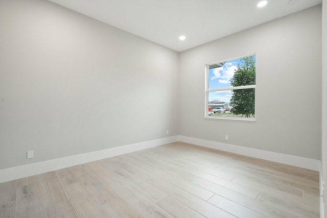 spare room with light hardwood / wood-style flooring