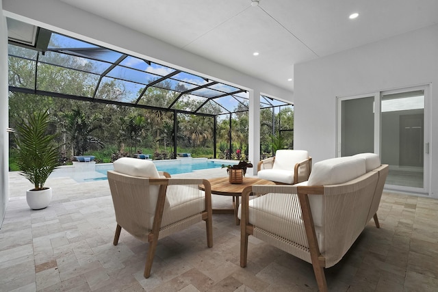 view of patio / terrace with an outdoor hangout area and glass enclosure