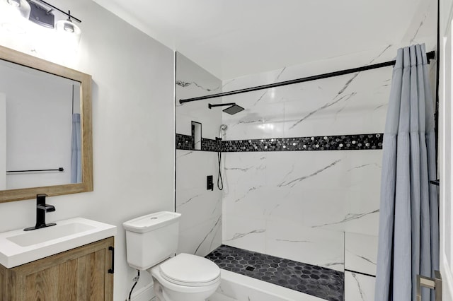 bathroom with vanity, curtained shower, and toilet