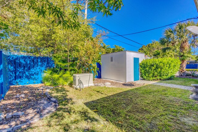 single story home with a front yard and a carport