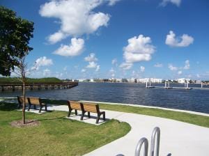 view of property's community featuring a water view and a yard