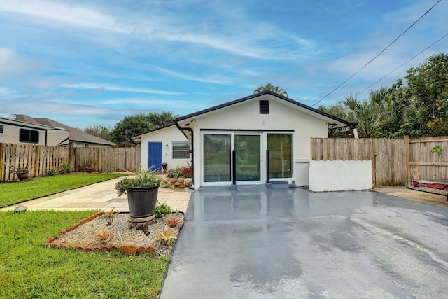 back of property featuring a patio