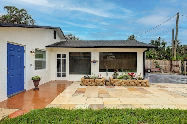 doorway to property with a patio area