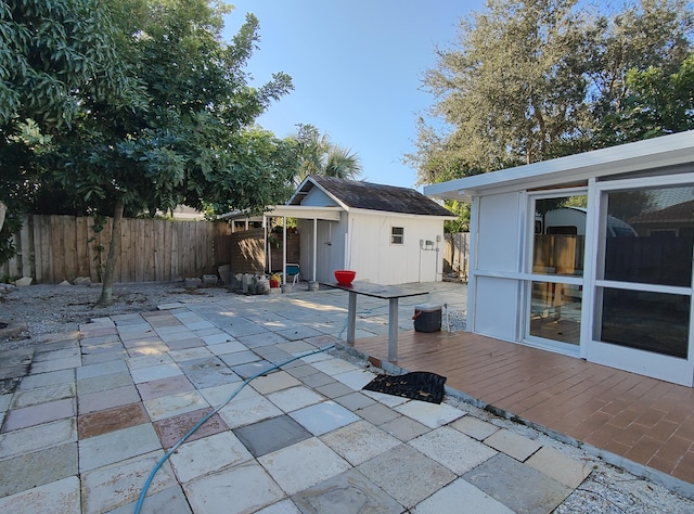 view of patio / terrace with a shed