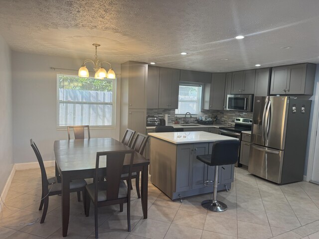 view of patio / terrace featuring a sunroom