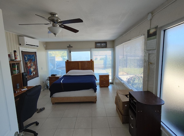 tiled bedroom with ceiling fan, baseboard heating, and a wall unit AC