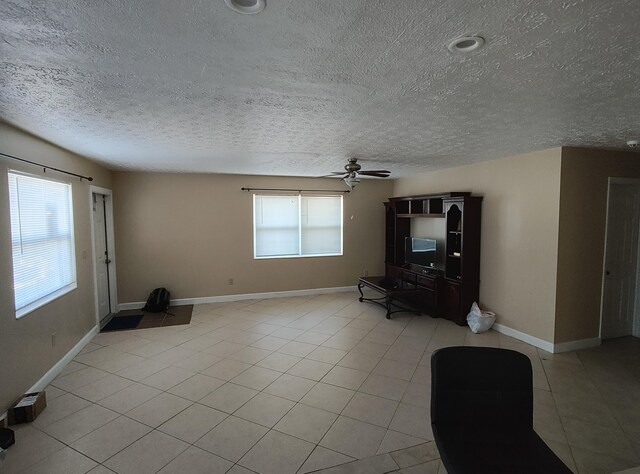 tiled bedroom featuring ceiling fan, an AC wall unit, and a baseboard radiator