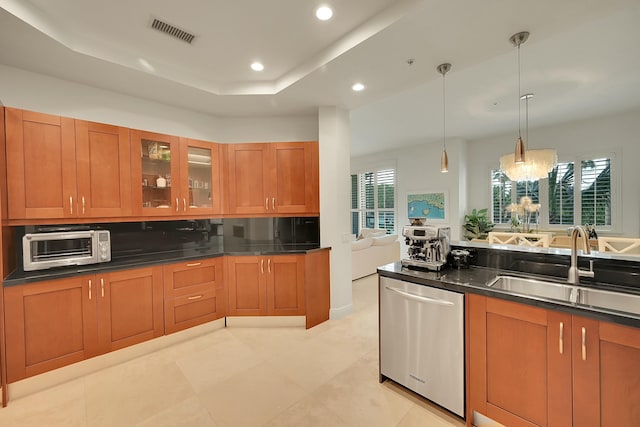 kitchen with dishwasher, an inviting chandelier, a healthy amount of sunlight, and sink