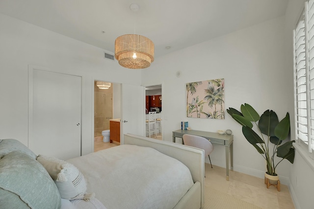 tiled bedroom with ensuite bath