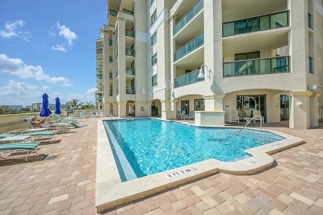 view of swimming pool featuring a patio area