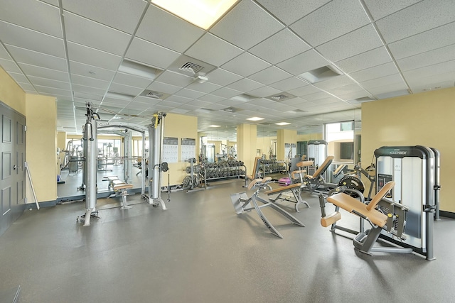 gym featuring a paneled ceiling