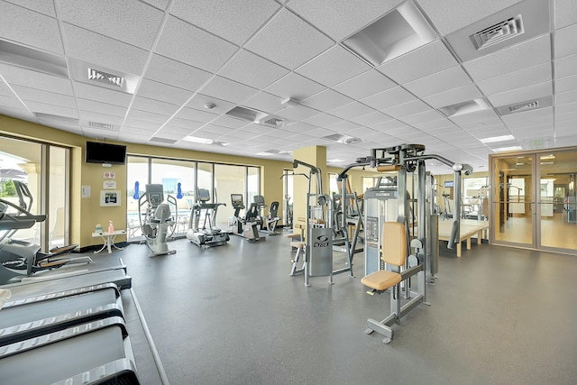 exercise room featuring a paneled ceiling