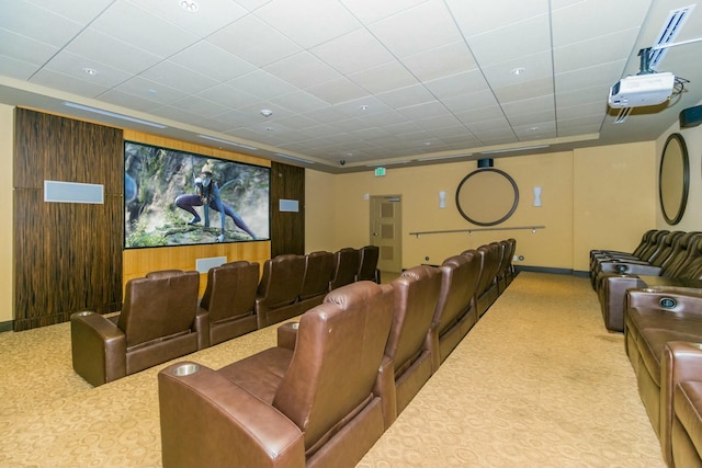 carpeted cinema featuring wood walls