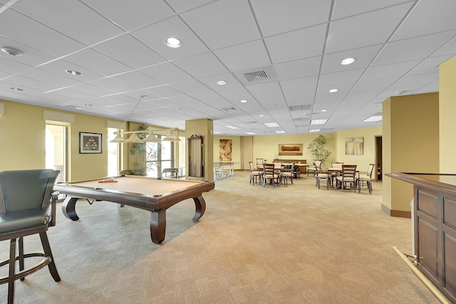 game room with light carpet, a paneled ceiling, and pool table