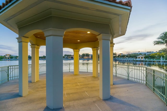 view of patio with a water view