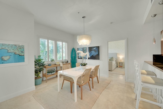 dining space featuring light tile patterned floors and a notable chandelier