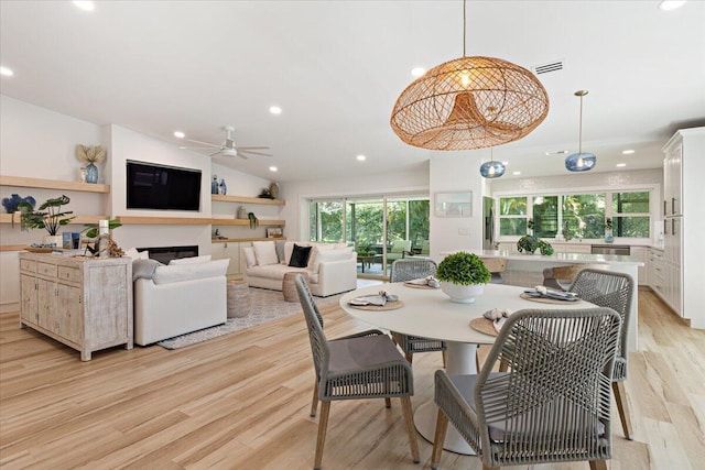 dining area with light wood finished floors, visible vents, recessed lighting, and a healthy amount of sunlight
