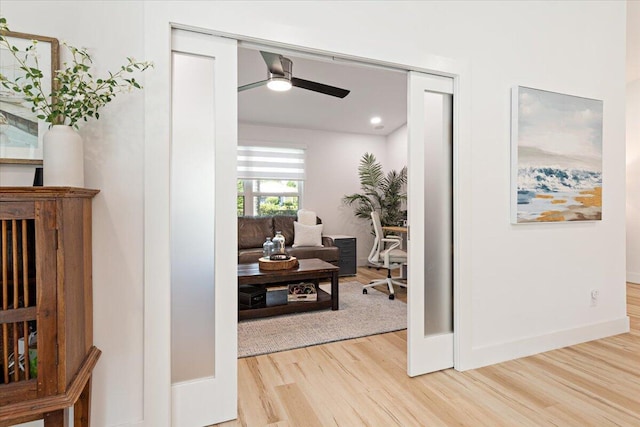 hallway with light wood-type flooring