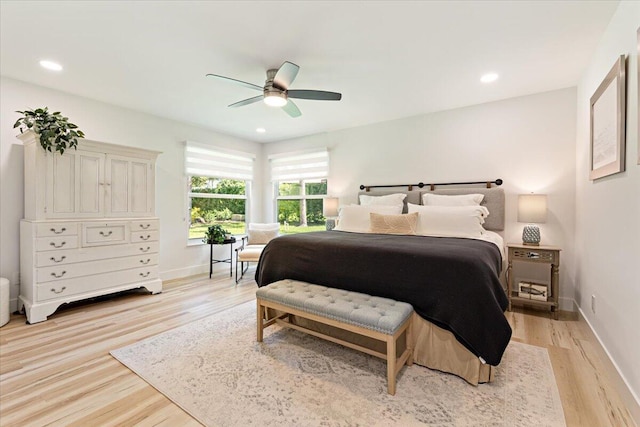 bedroom featuring light hardwood / wood-style floors and ceiling fan