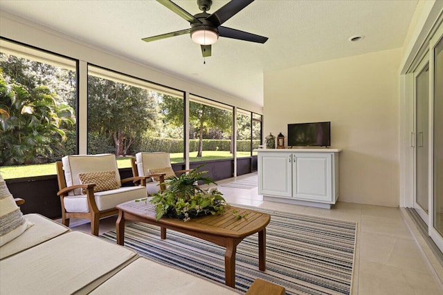 sunroom / solarium featuring ceiling fan