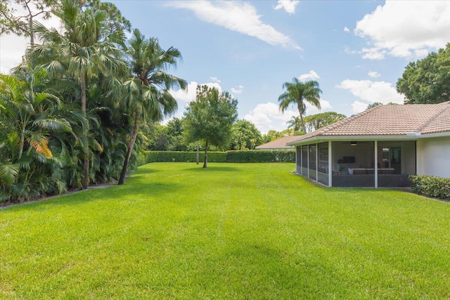 view of yard featuring a sunroom