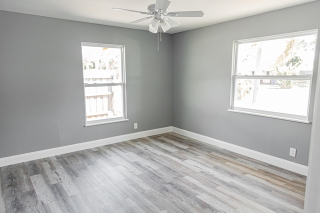 spare room with ceiling fan and light hardwood / wood-style flooring