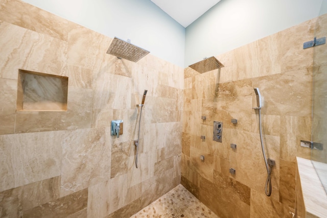 bathroom with tiled shower