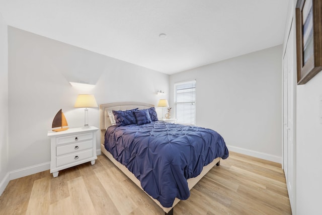 bedroom with light wood-type flooring