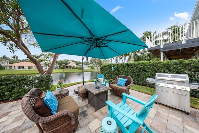 view of patio featuring a water view and an outdoor hangout area