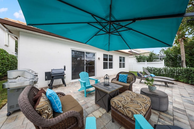 view of patio with area for grilling and an outdoor hangout area